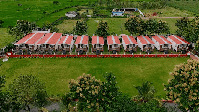 Royal Deluxe cottages beside the lawn at Shagun Farms