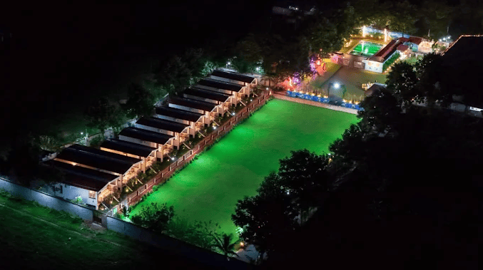 Lawn and cottages at night